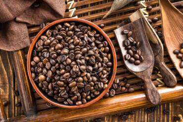 How do roasters manage their coffee supply?